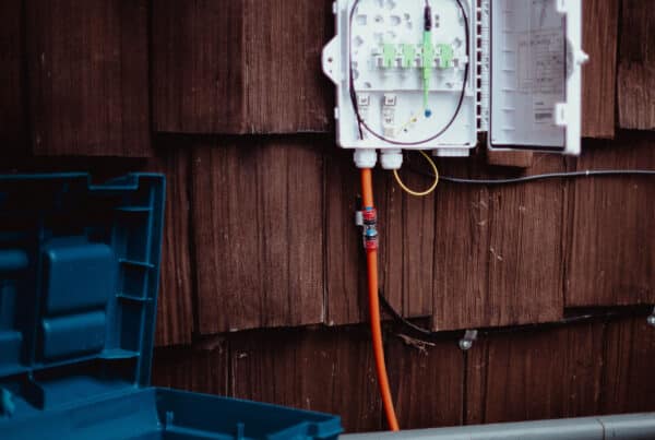 Fiber optic cable box on the side of the home