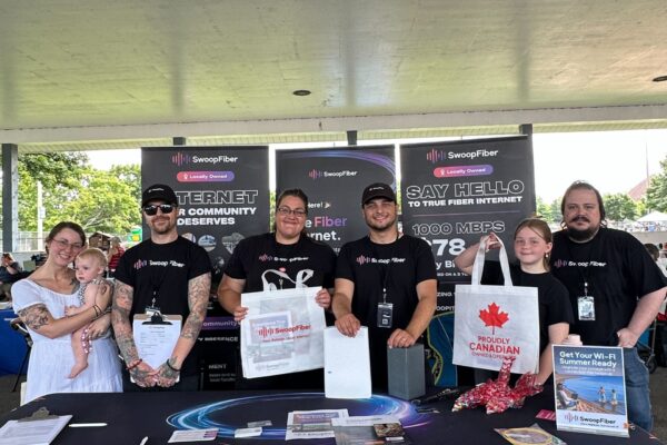 farmersmarketevent Staff at an event with SwoopFiber merchandise