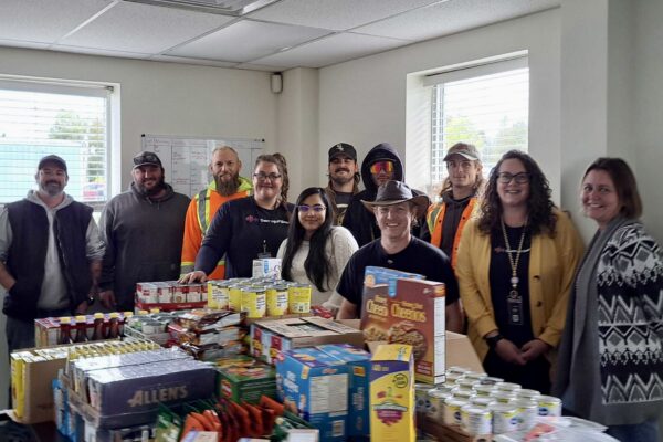 foodbankdonation SwoopFiber workers standing with food bank donations