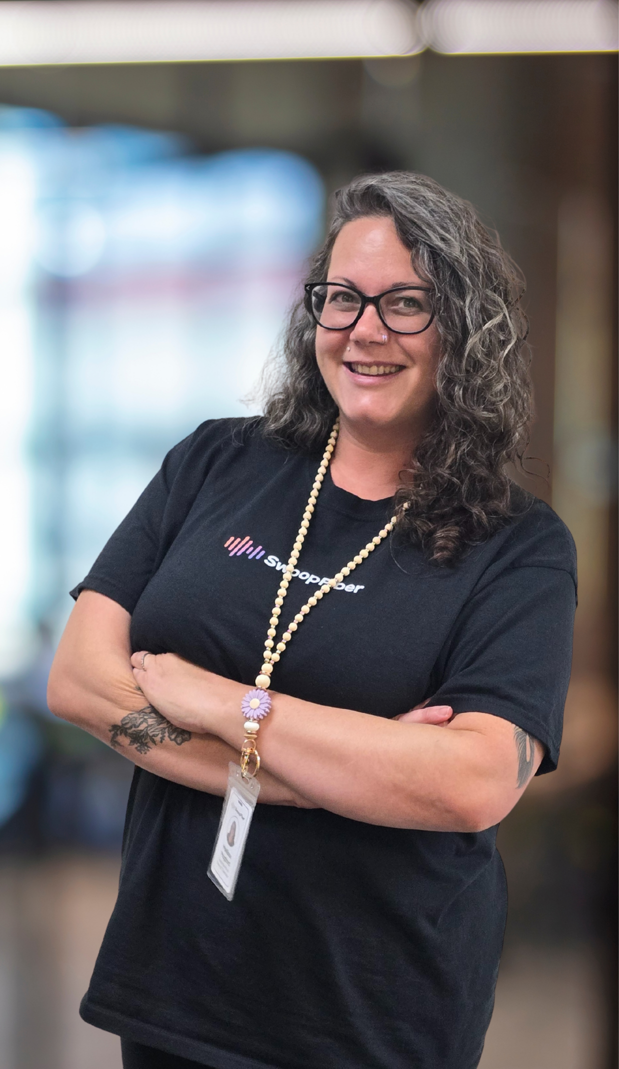 Mellissa SwoopFiber concierge specialist, standing with arms crossed.