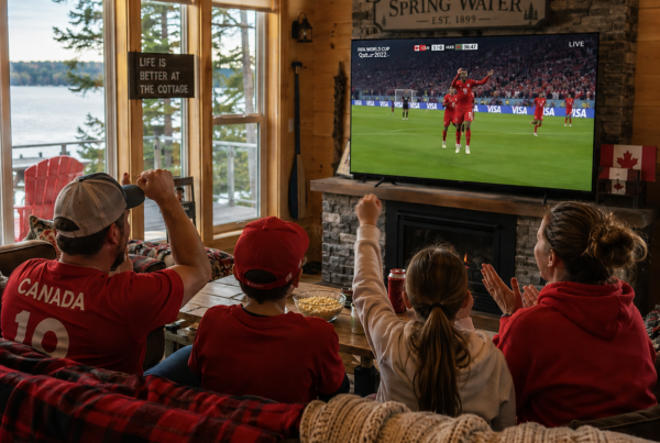 Family watching the FIFA World Cup in their cottage living room in Springwater ontario
